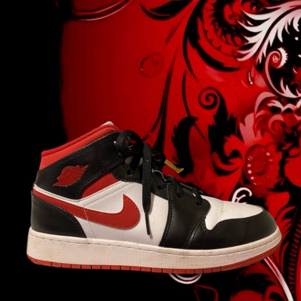 Red and black nike jordan 1 mid